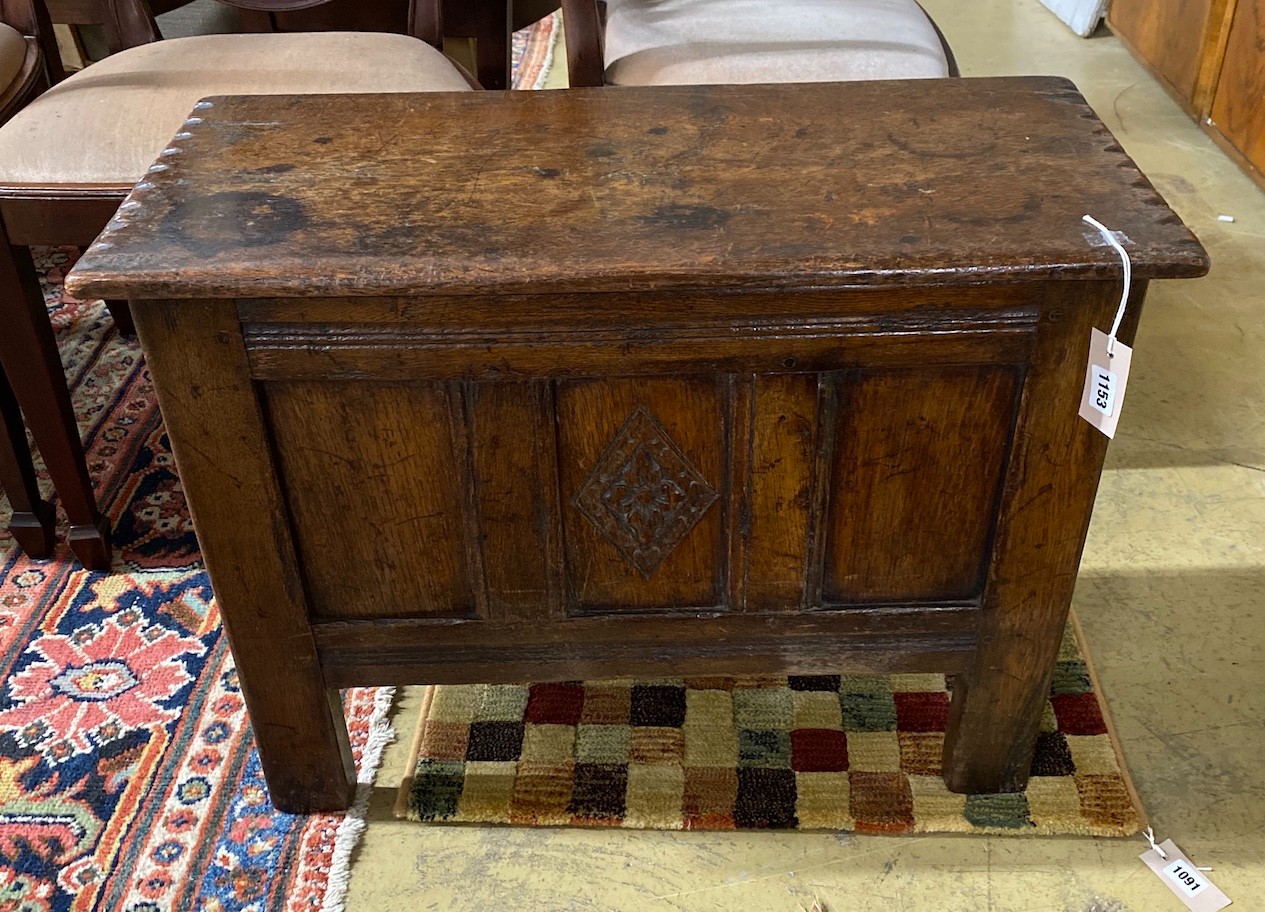 A small 17th century style panelled oak coffer, length 73cm, depth 33cm, height 55cm